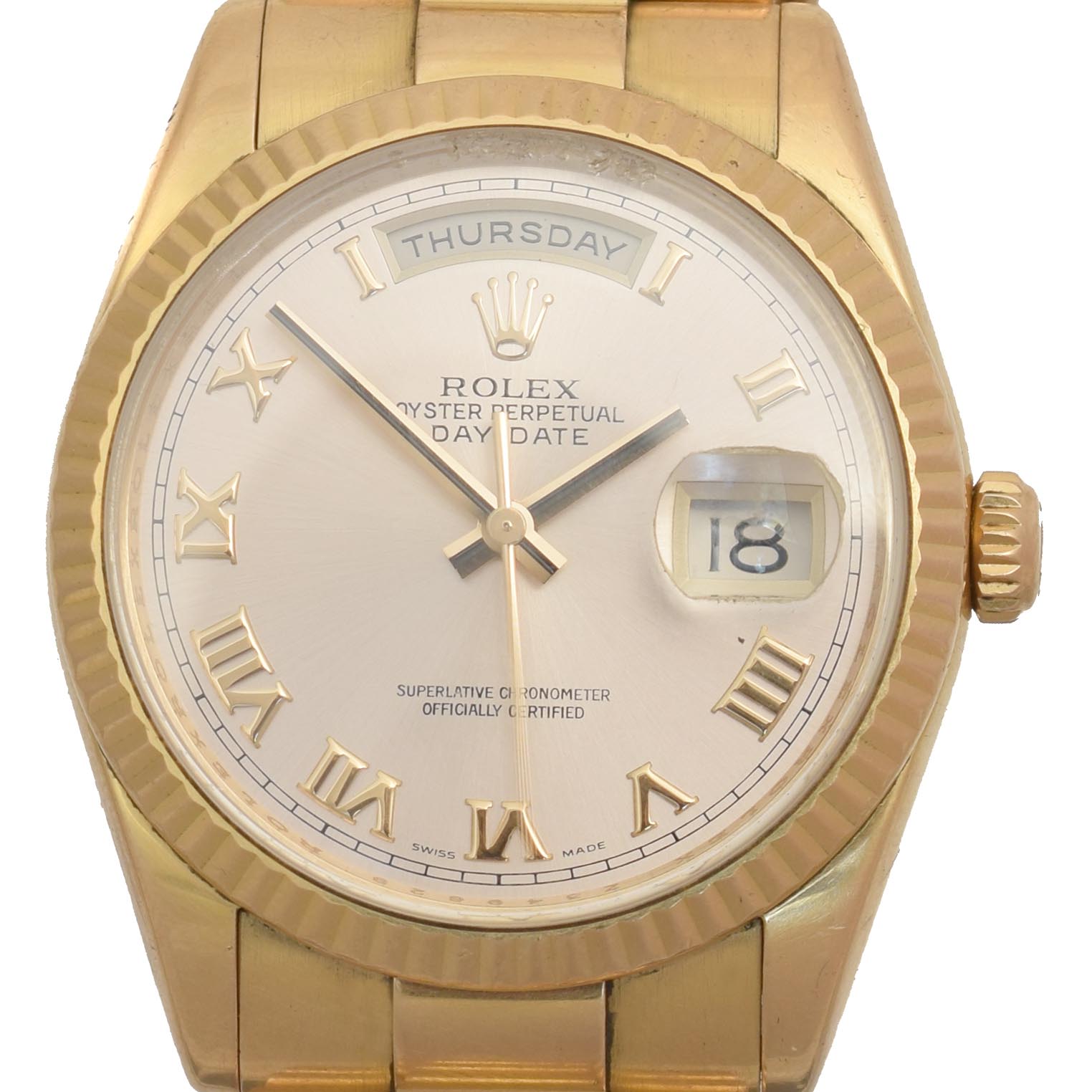 A gents 18ct gold Rolex Oyster Perpetual Day-Date wristwatch, circa 2006-7, the circular signed dial with Roman numeral hour markers, date aperture to 3 and day aperture to 12, with fluted bezel and president bracelet, model no. 118235, Z349629, Swiss assay marks, case diameter 36mm, with single spare link and papers. Sold for £8,540